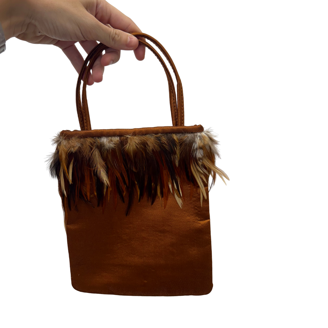 Bolso vintage ocre tipo saco con plumas