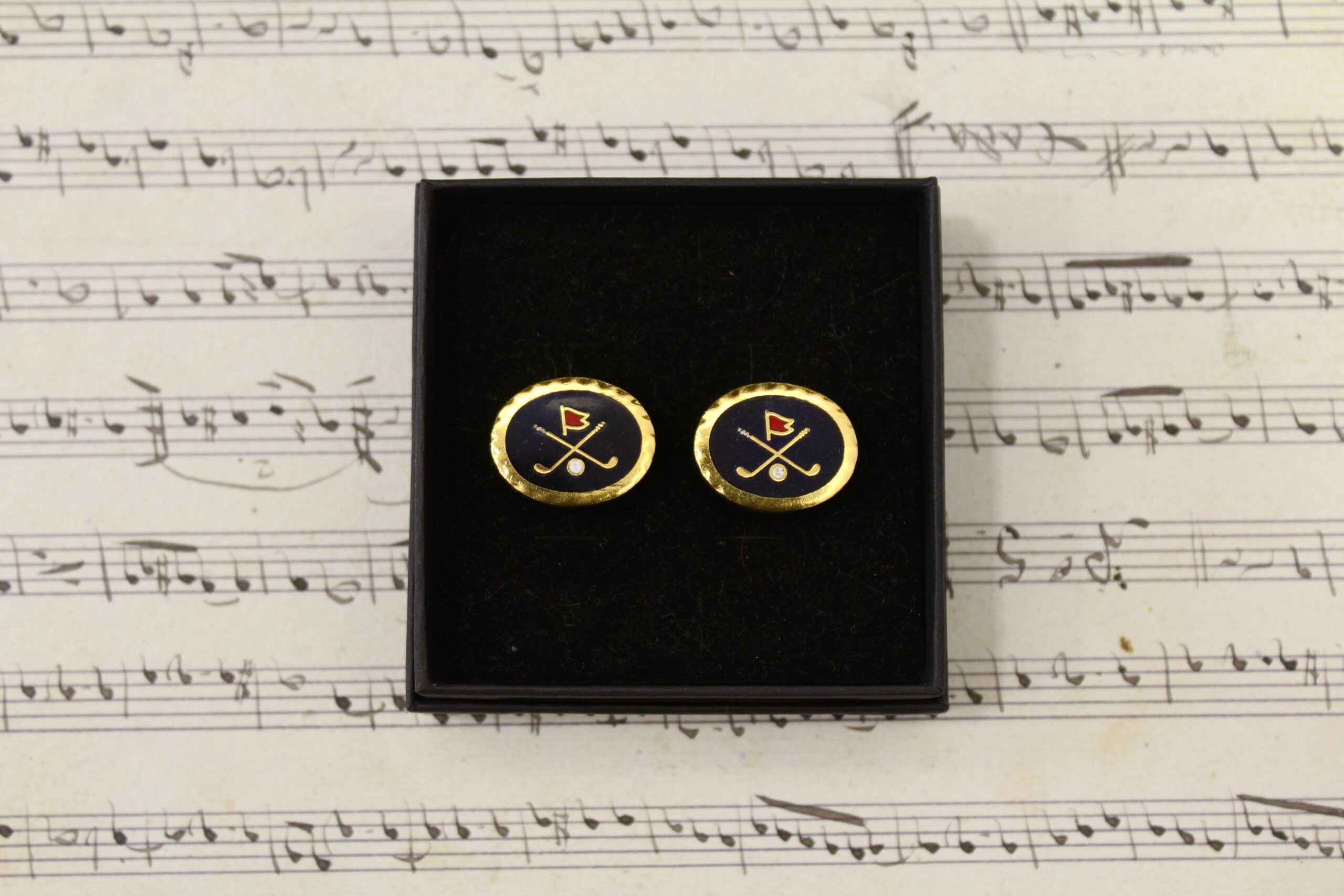 Gemelos vintage de Golf con filo dorado