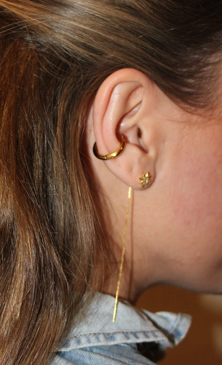 Brinco de pressão com zircónias cúbicas em forma de estrela dourada (unidade)