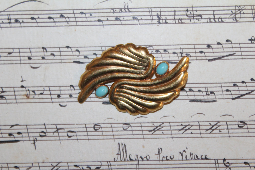 Broche vintage em folha de ouro