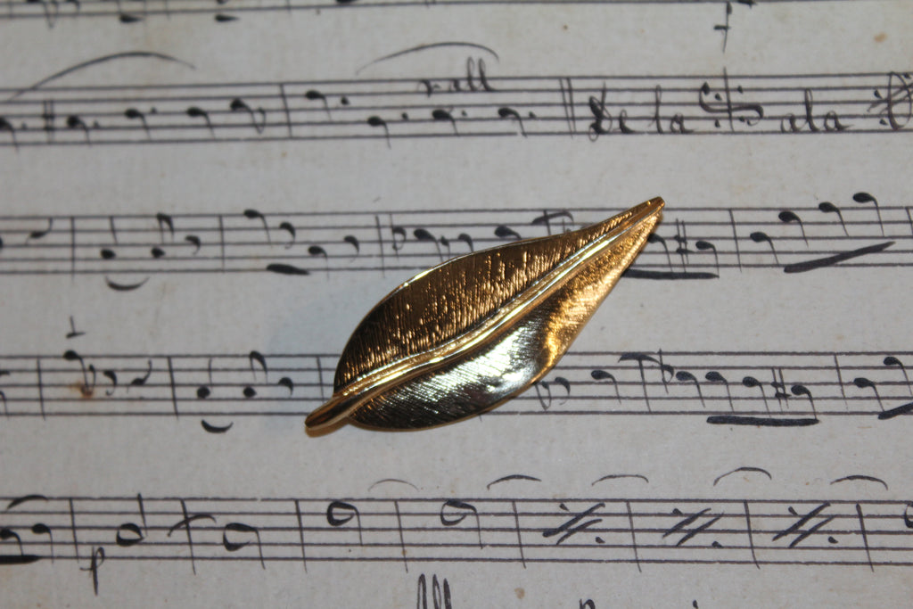 Broche vintage em folha de ouro