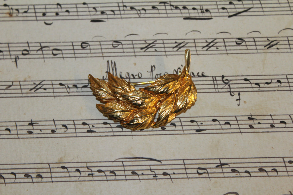 Broche vintage em folha de ouro