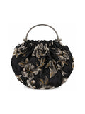 Bolso vintage negro tipo bombonera con flores